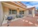 Outdoor patio area with a grill and comfortable seating, perfect for gatherings at 1009 Rustridge Ave, North Las Vegas, NV 89081