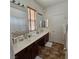 Well-lit bathroom boasts a long vanity with double sinks and plenty of space and storage at 1009 Rustridge Ave, North Las Vegas, NV 89081