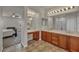 Bright bathroom with dual sink vanity, makeup area, and bedroom access at 1009 Rustridge Ave, North Las Vegas, NV 89081