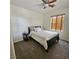 Inviting bedroom with window, ceiling fan, and neutral color scheme at 1009 Rustridge Ave, North Las Vegas, NV 89081