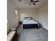 Bedroom featuring ceiling fan, window, and plush carpet at 1009 Rustridge Ave, North Las Vegas, NV 89081