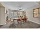 Dining room with fireplace, a ceiling fan, and lots of natural light at 1009 Rustridge Ave, North Las Vegas, NV 89081
