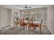 Light and airy dining room with fireplace, large windows and stylish furniture at 1009 Rustridge Ave, North Las Vegas, NV 89081