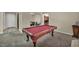 Entertaining game room with a pool table and seamless access to other rooms at 1009 Rustridge Ave, North Las Vegas, NV 89081