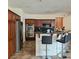 Kitchen boasts stainless steel appliances, breakfast bar with seating and granite countertops at 1009 Rustridge Ave, North Las Vegas, NV 89081