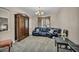 Spacious carpeted living room featuring a sofa, armoire, and recessed lighting at 1009 Rustridge Ave, North Las Vegas, NV 89081