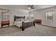 Elegant main bedroom featuring plush carpeting, neutral decor, and ample natural light at 1009 Rustridge Ave, North Las Vegas, NV 89081