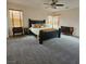 Comfortable main bedroom with stylish decor, plush carpeting, and abundant natural light at 1009 Rustridge Ave, North Las Vegas, NV 89081