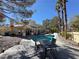 Backyard pool with patio furniture and a view of the house at 12 Innisbrook Ave, Las Vegas, NV 89113