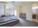 Bedroom boasting a ceiling fan, a work space, and a private bathroom with marble floors at 12 Innisbrook Ave, Las Vegas, NV 89113