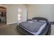 Bedroom with a walk-in closet, access to the home's upper level, and hardwood floors at 12 Innisbrook Ave, Las Vegas, NV 89113