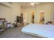 Bedroom with a ceiling fan, a mounted television, a closet, and access to a bathroom at 12 Innisbrook Ave, Las Vegas, NV 89113