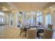 Spacious dining room featuring a black marble table, chandelier, and tiled flooring at 12 Innisbrook Ave, Las Vegas, NV 89113