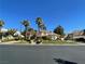 Elegant home boasts a grand entrance with lush landscaping and mature palm trees at 12 Innisbrook Ave, Las Vegas, NV 89113
