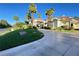 Elegant home exhibiting stately columns, lush landscaping, and an expansive driveway at 12 Innisbrook Ave, Las Vegas, NV 89113
