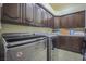 Laundry room featuring a washer, a dryer, and extensive cabinet storage at 12 Innisbrook Ave, Las Vegas, NV 89113