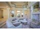 Spacious living room with high ceilings, grand columns, and a seamless transition to other areas of the home at 12 Innisbrook Ave, Las Vegas, NV 89113