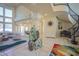 Expansive living room with tile floors, grand columns, high ceilings, and a spiral staircase leading to upper levels at 12 Innisbrook Ave, Las Vegas, NV 89113