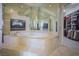 Luxurious main bathroom featuring a jacuzzi tub and direct access to a walk-in closet at 12 Innisbrook Ave, Las Vegas, NV 89113