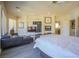 Spacious main bedroom showcasing hardwood floors, a fireplace, and a comfy sitting area at 12 Innisbrook Ave, Las Vegas, NV 89113