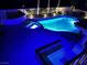 Aerial nighttime view of a luxurious pool and spa illuminated with vibrant blue lighting at 12 Innisbrook Ave, Las Vegas, NV 89113