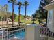 Balcony view of a refreshing pool and lush community landscaping at 12 Innisbrook Ave, Las Vegas, NV 89113