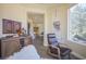 Inviting sitting area with a modern chair and window views at 12 Innisbrook Ave, Las Vegas, NV 89113