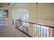 Elegant staircase with ornamental wrought iron railing and neutral carpeting at 12 Innisbrook Ave, Las Vegas, NV 89113