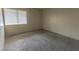 Neutral bedroom showcasing comfortable carpeting and a sun-drenched window at 1405 E Vegas Valley Dr # 112, Las Vegas, NV 89169