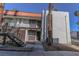 Charming two-story condo with brown accents, complemented by desert landscaping and a red tile roof at 1405 E Vegas Valley Dr # 112, Las Vegas, NV 89169