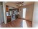 Cozy kitchen featuring wood cabinets, white appliances, and an adjacent dining area at 1405 E Vegas Valley Dr # 112, Las Vegas, NV 89169