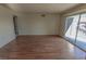 Bright and open living room featuring sliding glass doors leading to a private balcony at 1405 E Vegas Valley Dr # 112, Las Vegas, NV 89169