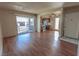 Inviting living area with hardwood flooring, adjacent to an open kitchen and a bright, sunlit balcony at 1405 E Vegas Valley Dr # 112, Las Vegas, NV 89169