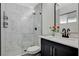 Modern bathroom with a glass walk-in shower and granite vanity at 1500 Saylor Way, Las Vegas, NV 89108