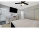 This bedroom boasts a ceiling fan, closet and ensuite bath at 1500 Saylor Way, Las Vegas, NV 89108