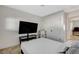 Comfortable bedroom with a large television set up and a view into the next room at 1500 Saylor Way, Las Vegas, NV 89108
