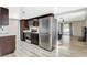 Modern kitchen featuring stainless steel appliances and dark cabinetry at 1500 Saylor Way, Las Vegas, NV 89108