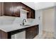 This kitchen features stone countertops, wood cabinets and stainless steel appliances at 1500 Saylor Way, Las Vegas, NV 89108