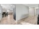 Spacious living room with laminate flooring and multiple views of the kitchen at 1500 Saylor Way, Las Vegas, NV 89108