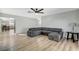 Open-concept living room with laminate flooring and a gray couch at 1500 Saylor Way, Las Vegas, NV 89108