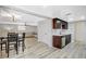 Open floor plan with a living room and dining area featuring hardwood floors and modern decor at 1500 Saylor Way, Las Vegas, NV 89108