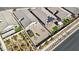Aerial view of the property showcases the spacious backyard, desert landscaping, pergola, and neighborhood at 2255 Woodbluff Ave, North Las Vegas, NV 89086