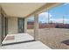 Covered back patio with ample space for outdoor lounging, providing shade and views of the blank canvas backyard at 2255 Woodbluff Ave, North Las Vegas, NV 89086