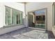 Covered back patio with sliding glass doors, showcasing tiled floors and seamless indoor-outdoor living at 2255 Woodbluff Ave, North Las Vegas, NV 89086