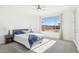 Bright bedroom with a large window, ceiling fan, and ample natural light at 2255 Woodbluff Ave, North Las Vegas, NV 89086