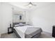 Bedroom featuring soft gray carpet, ceiling fan and a large window at 2255 Woodbluff Ave, North Las Vegas, NV 89086