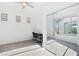 Bedroom with a fan and desk that connects to a sun room with sliding glass doors at 2255 Woodbluff Ave, North Las Vegas, NV 89086