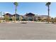 Exterior view of the community clubhouse features desert landscaping, ample parking, and modern architectural design at 2255 Woodbluff Ave, North Las Vegas, NV 89086