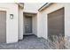 Home featuring a stylish front door, desert landscaping, and a paved driveway at 2255 Woodbluff Ave, North Las Vegas, NV 89086