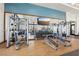 Spacious gym featuring modern LifeFitness equipment, free weights, and mirrored wall for a complete fitness experience at 2255 Woodbluff Ave, North Las Vegas, NV 89086